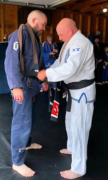 Ben Quigley receiving his Brazilian Jiu-Jitsu black belt